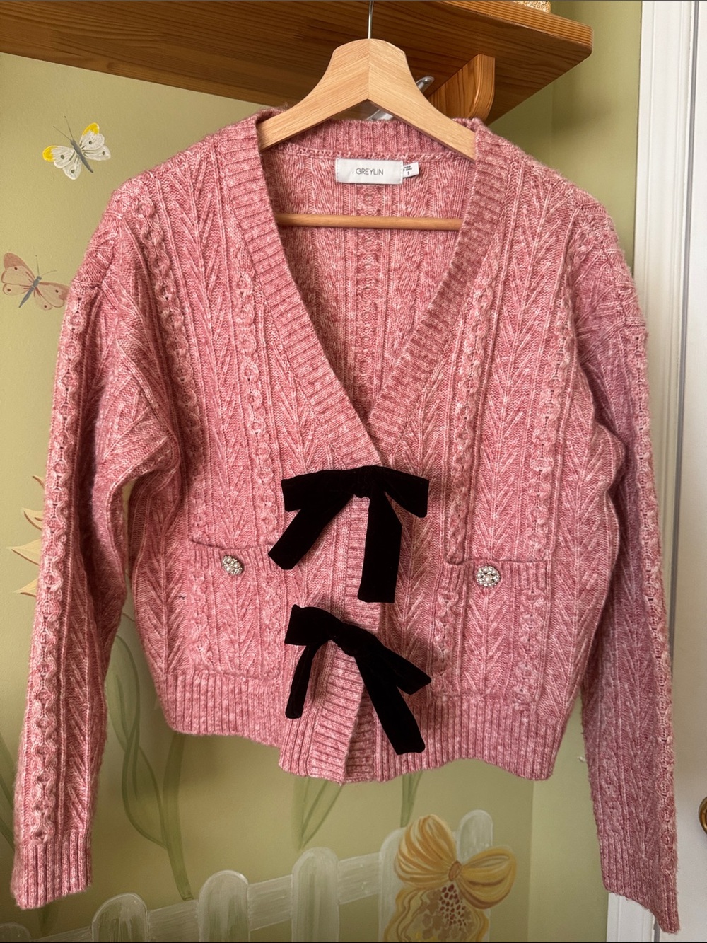 Pink Cable-Knit Cropped Cardigan with Black Velvet Bows